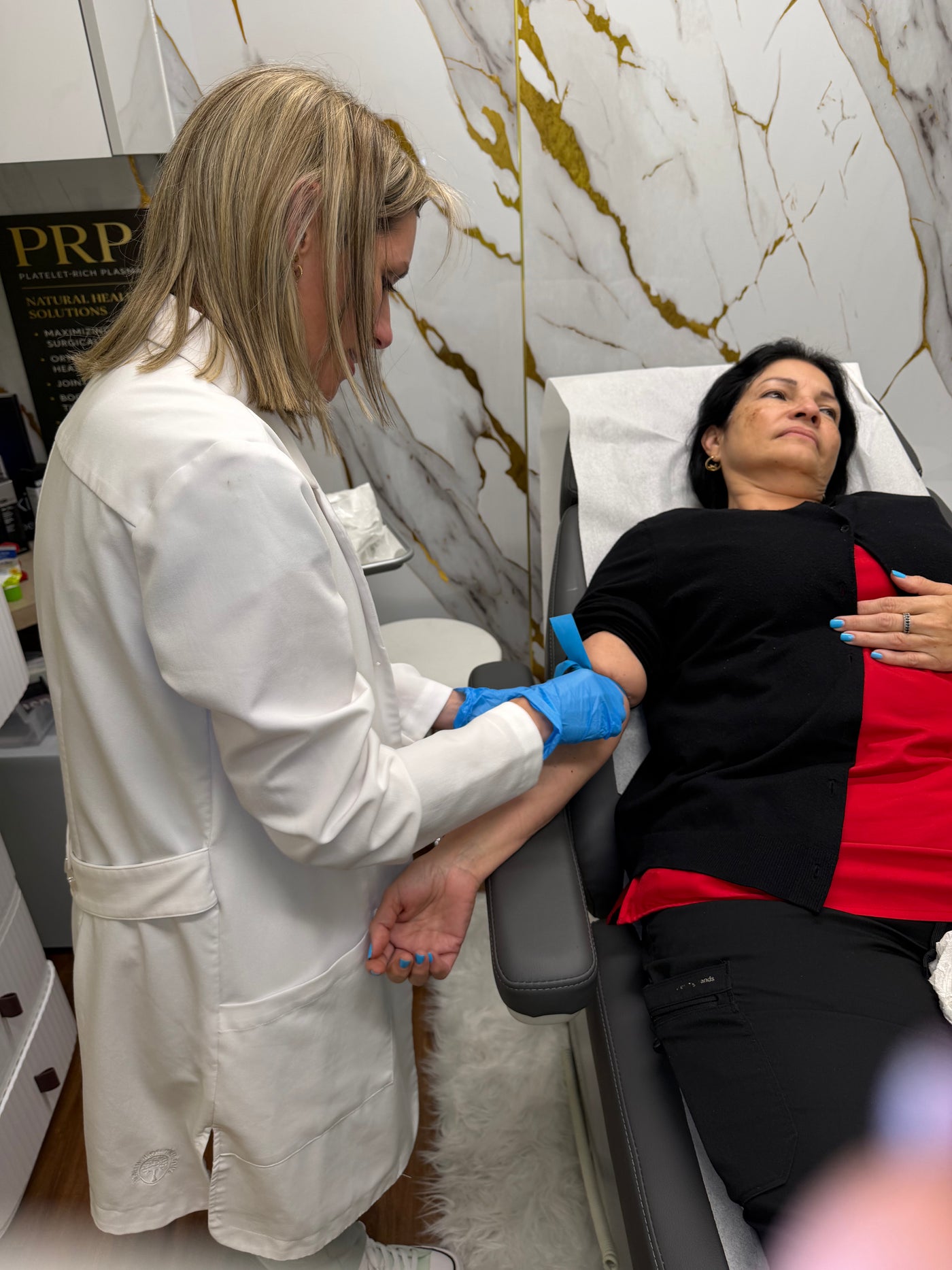 Clinician providing a treatment at IV Drop Revival & Glow medical spa in Miami